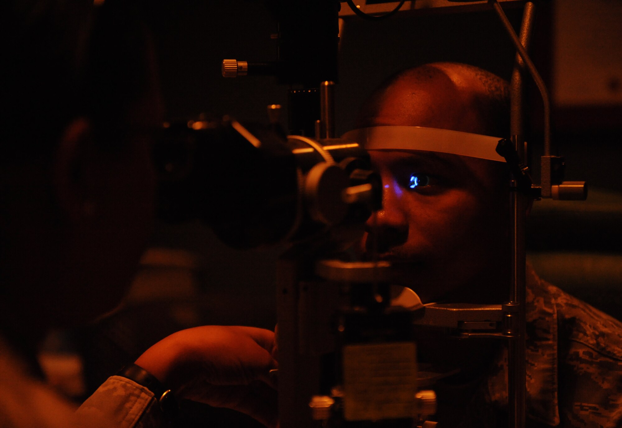 Senior Airman Deven Sherk, 2nd Maintenance Squadron phase support, has his eyes checked for abrasions during an eye examination at the Optometry Clinic on Barksdale Air Force Base, La., Feb. 20. The Optometry Clinic has a variety of tools to test different areas of the eye as well as check for various health issues. A standard eye exam will consist of a visual acuity check used to determine a change in vision and other procedures to ensure the patient's eyes are healthy and free of disease. (U.S. Air Force photo/Airman 1st Class Benjamin Gonsier)

