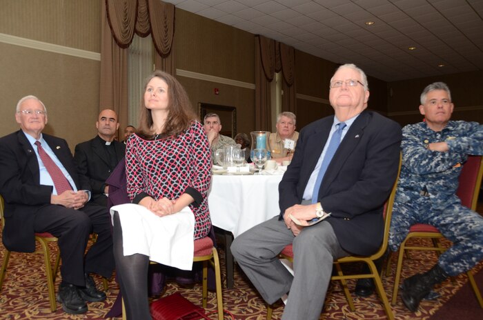 The 60th Annual National Prayer Breakfast attendes listen during Navy Chaplain (Capt.) Kyle Fauntleroy's, Naval Chaplaincy School and Center commanding officer, remarks Feb. 20, 2013, at the Redbank Club, at Joint Base Charleston - Weapons Station, S.C. The National Prayer Breakfast, started in 1953 by President Dwight Eisenhower, continues to offer modern day leaders and civilians the opportunity to join in fellowship and prayer. (U.S. Navy photo / Petty Officer 1st Class Chad Hallford)