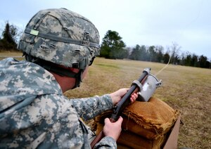 U.S. Army Sgt. Bryan Rose, a test firer assigned to the 97th Transportation Company, 10th Transportation Battalion, 7th Sustainment Brigade, fires a metal rod with the Bridger Line Throwing Appliance at Fort Eustis, Va., Feb. 13, 2013. The team of Soldiers assigned to the post's Ammunition Supply Point ensures customers will be able to access ammunition until contractors take over operations. (U.S. Army photo by Sgt. Edwin Rodriguez/Released)
