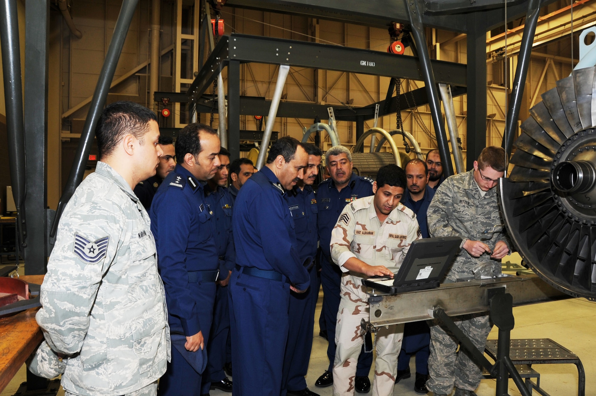 Royal Saudi Air Force Maj. Gen. Saeed Muedh Alzahrani, commander of the RSAF Technical Studies Institute, learns about aerospace propulsion systems from an RSAF student at the 361st Training Squadron at Sheppard Air Force Base, Texas, Feb. 21, 2013.  Alzahrani visited the base to get a first-hand look at the overall technical training environment. (U.S. Air Force photo/Joshua Felton)