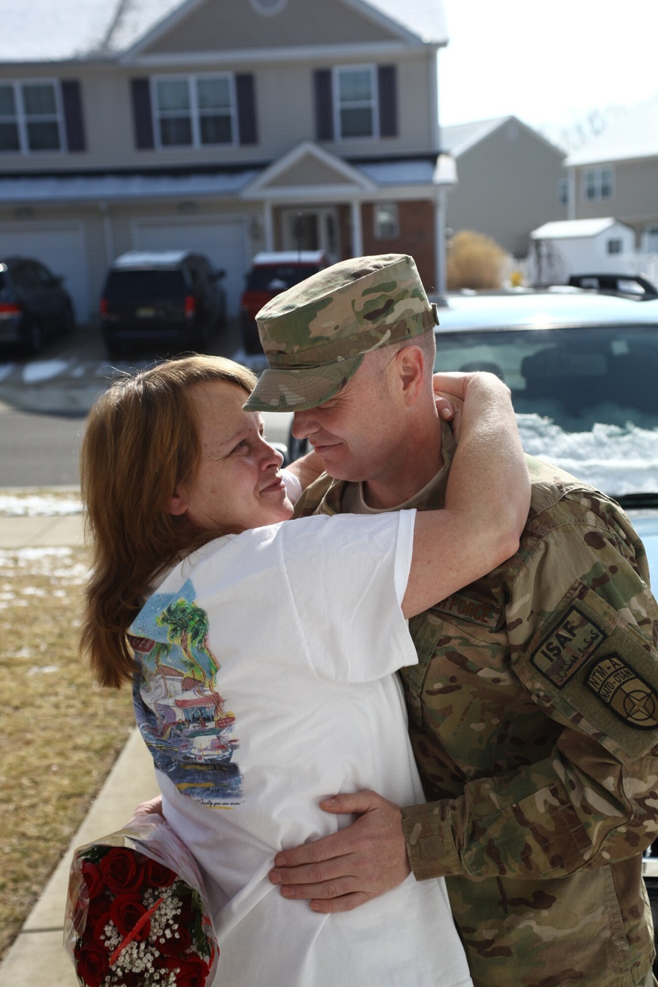 Senior Master Sgt. Joey Bailey, 605th Aircraft Maintenance Squadron production superintendent, surprises his wife, Kim, Feb. 14, 2013, by returning home to Joint Base McGuire-Dix-Lakehurst, N.J., a week early from a year-long temporary duty assignment to Kabul, Afghanistan. Kim was expecting a Valentine's Day delivery, but did not know members of the 605th AMXS and her husband had set her up for a surprise reunion. (U.S. Air Force photo by Wayne Russell/Released)