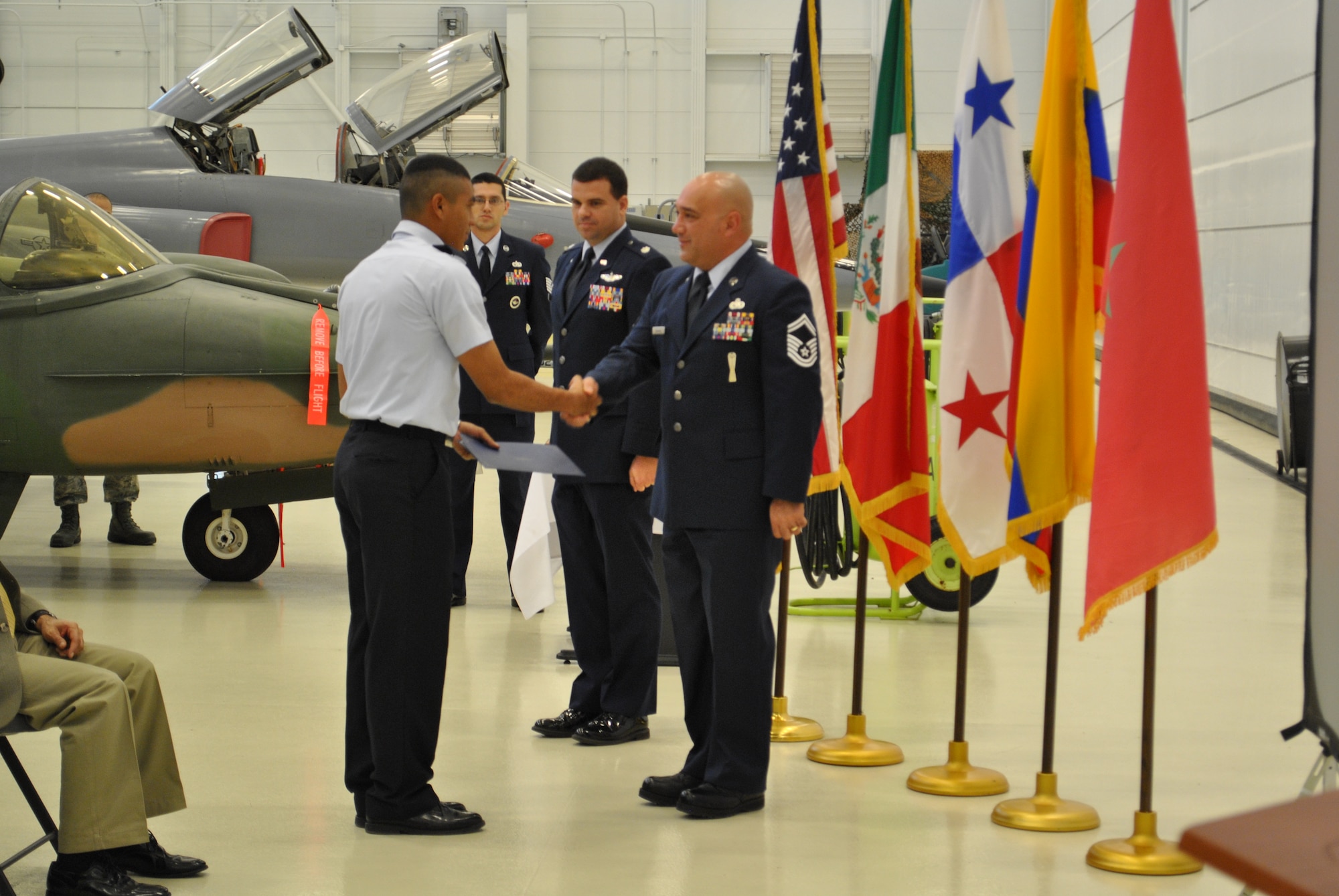 On Friday February 15, 2013, ten students graduated from the "Search and
Rescue Planning" course at the Inter-American Air Forces Academy (IAAFA) in
San Antonio, Texas.  The training concepts taught in this course focus on
planning for a search and rescue mission, and include how to hone a distress
signal, how to coordinate search and rescue efforts with other agencies, the
mathematical calculations on how wind, sea currents, or debris drift affect
a lost vessel or airplane, and how to manage a search and rescue command
post.  The newly-graduated students come from the Mexican Navy, Mexican
Federal Police, Panamanian Public Forces, Colombian Air Force - and for the
first time in IAAFA's 69-year history - a student from the Royal Moroccan
Air Force.  This course emulates the Maritime Search and Rescue Planning
Course taught at the U.S. Coast Guard's Maritime Search and Rescue School.
The only significant difference is that this course is taught in Spanish, as
IAAFA's 33 other courses.  These graduates now join an elite club of more
than 44,000 alumni of the academy. (U.S. Air Force courtesy photo)
