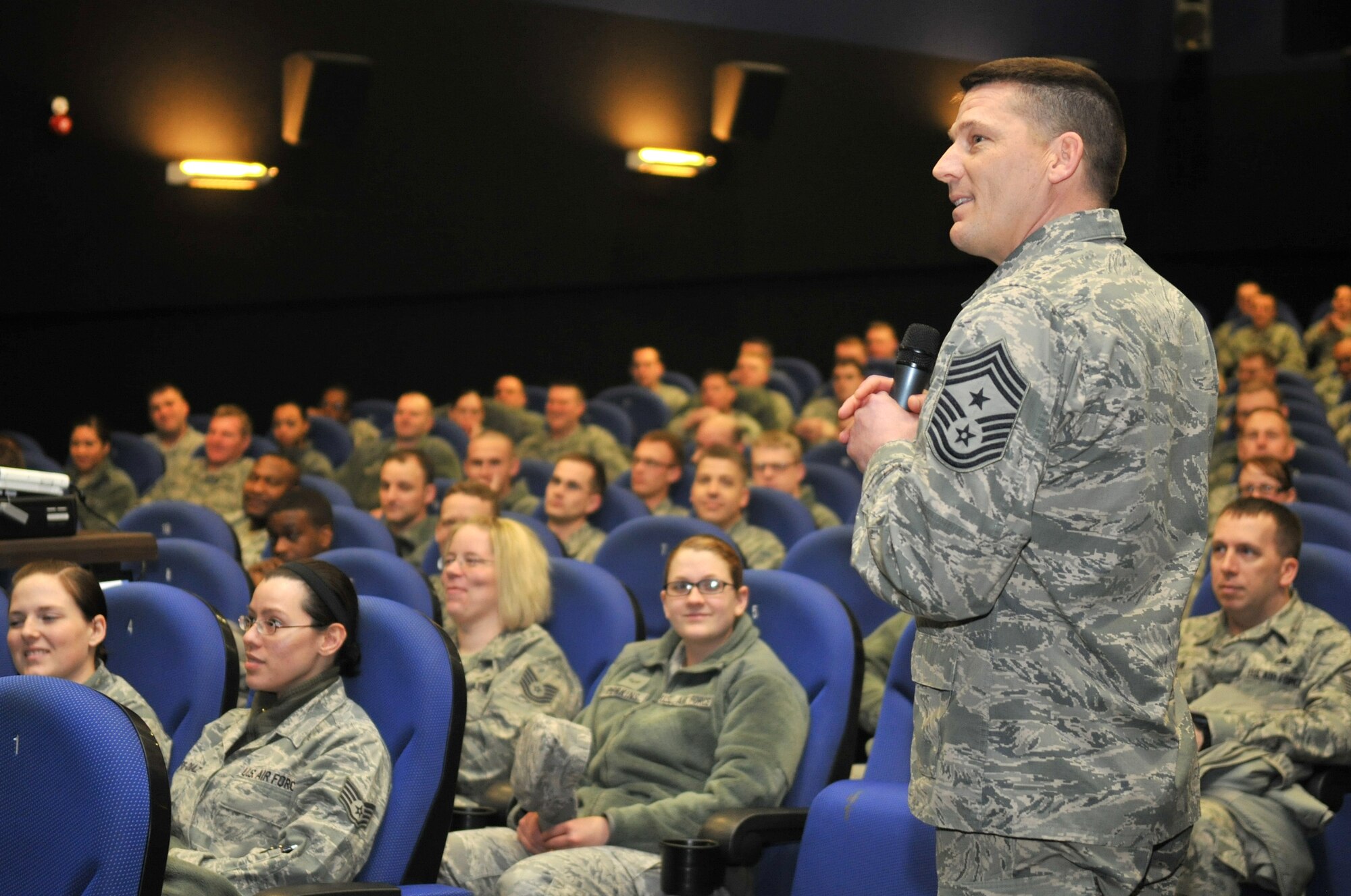 Chief Master Sgt. Tracy Jones, 100th Air Refueling Wing command chief, speaks to enlisted Airmen during his first enlisted all-call Feb. 21, 2013, at RAF Mildenhall, England. Jones, a native of Phillips, Texas, was previously based at Ramstein Air Base, Germany, where he served as the 86th Mission Support Group superintendent.  (U.S. Air Force photo by Senior Airman Jerilyn Quintanilla/Released)