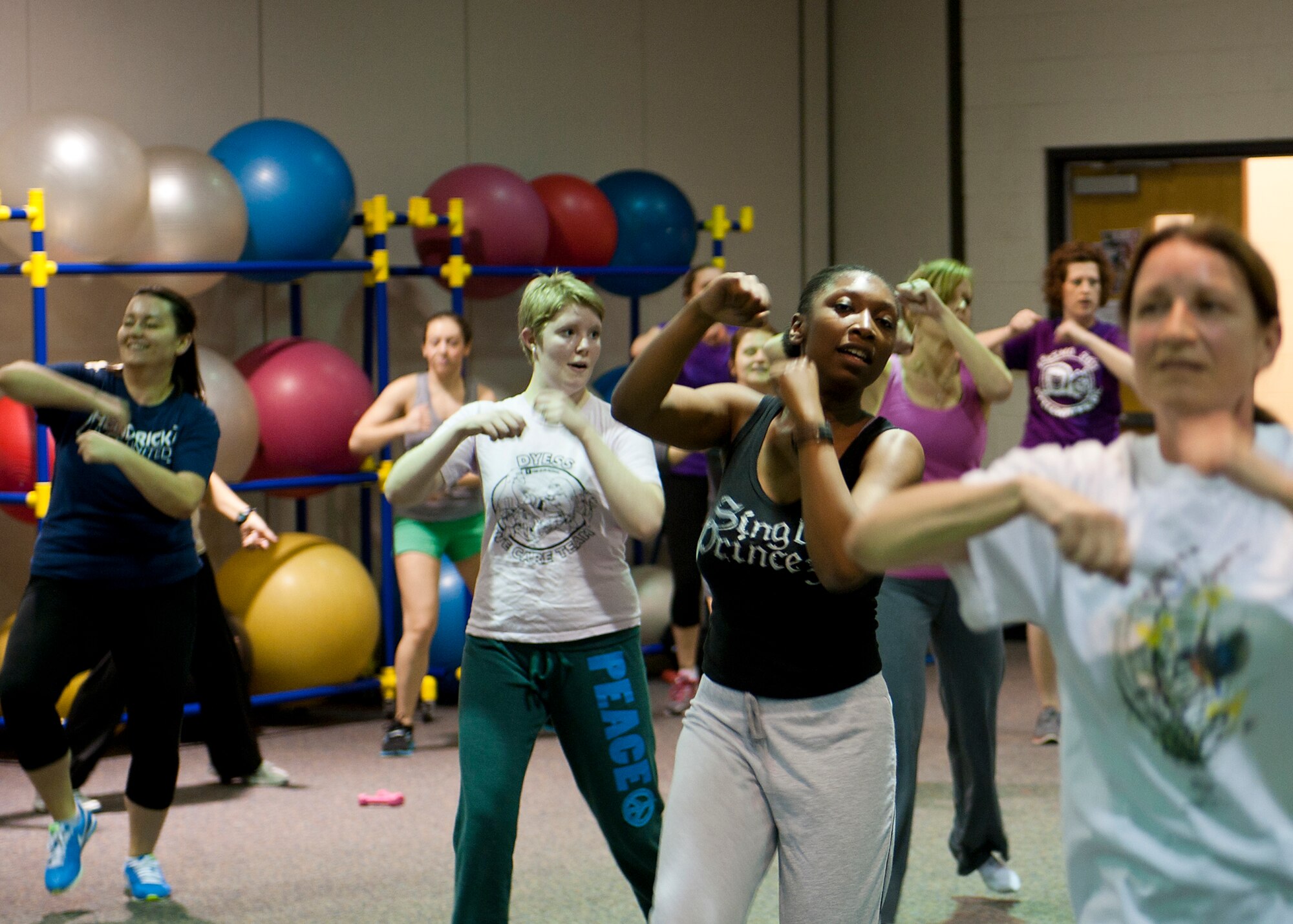 Members of Team Dyess participate in a Zumba fitness class Feb. 13, 2013, at Dyess Air Force Base, Texas. Zumba is a fitness program that involves dance and aerobic elements. The class is held Mondays and Wednesdays from 5 to 6 p.m., and Tuesdays and Thursdays from 6:30 to 7:30 p.m. at the fitness center. For more information, call (325) 696-4306. (U.S. Air Force photo by Airman 1st Class Damon Kasberg/ Released)