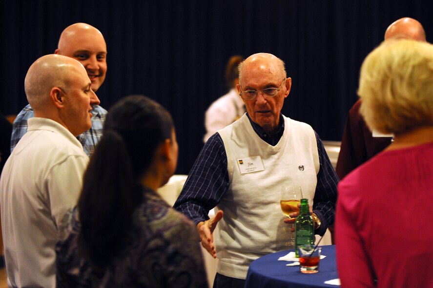 Retired U.S. Air Force Chief Master Sgt. James M. McCoy, the sixth Chief Master Sergeant of the Air Force 1979 – 1981, greets Air Combat Command’s newest Chief Master Sergeants at a mixer held at the Patriot Club Jan. 27 at Offutt Air Force Base, Neb.  The new chiefs will spend a week at Offutt gaining further insight as to what the rank entails and what is to be expected of them in this milestone.  (U.S. Air Force photo by Josh Plueger/Released)