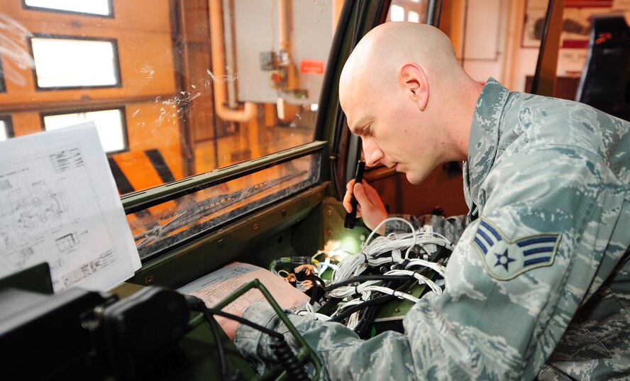 Senior Airman Nathan Carolan, 86th Vehicle Readiness Squadron vehicle maintenance apprentice, works on a wiring issue inside a 1078A1 light mobility terrain vehicle on Ramstein Air Base, Germany, Jan. 9, 2013. Carolan repaired the wiring to fix a no start condition. (U.S. Air Force photo/Airman 1st Class Jordan Castelan)