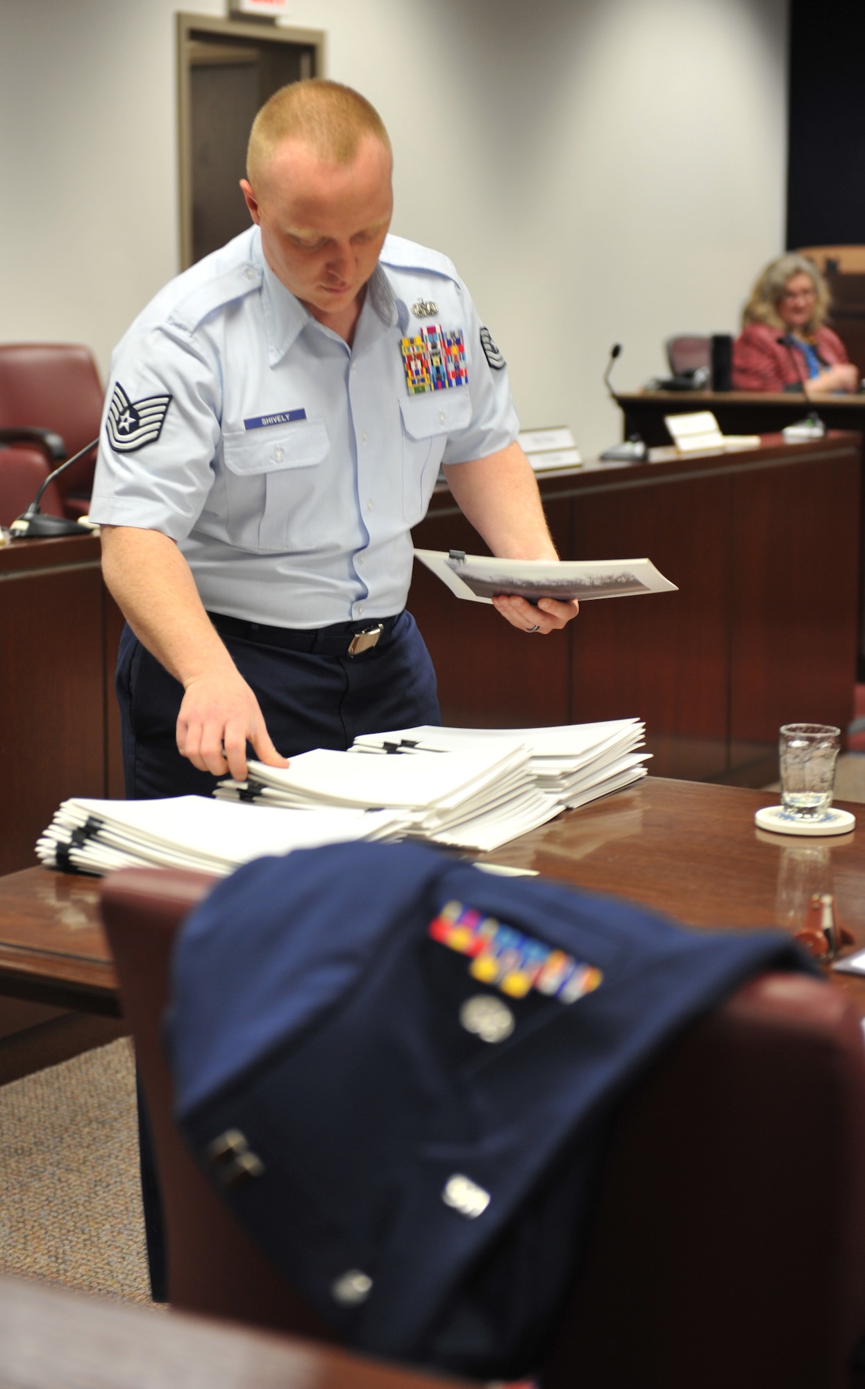 WHITEMAN AIR FORCE BASE, Mo. -- Tech. Sgt. Matthew Shively, 509th Bomb Wing Legal Military Justice NCO in charge, prepares for court during his shift at the Whiteman AFB court room, Feb. 12, 2013. Shively strives to provide the best possible support to Team Whiteman works toward accomplishing his goals. (U.S. Air Force photo/Heidi Hunt)