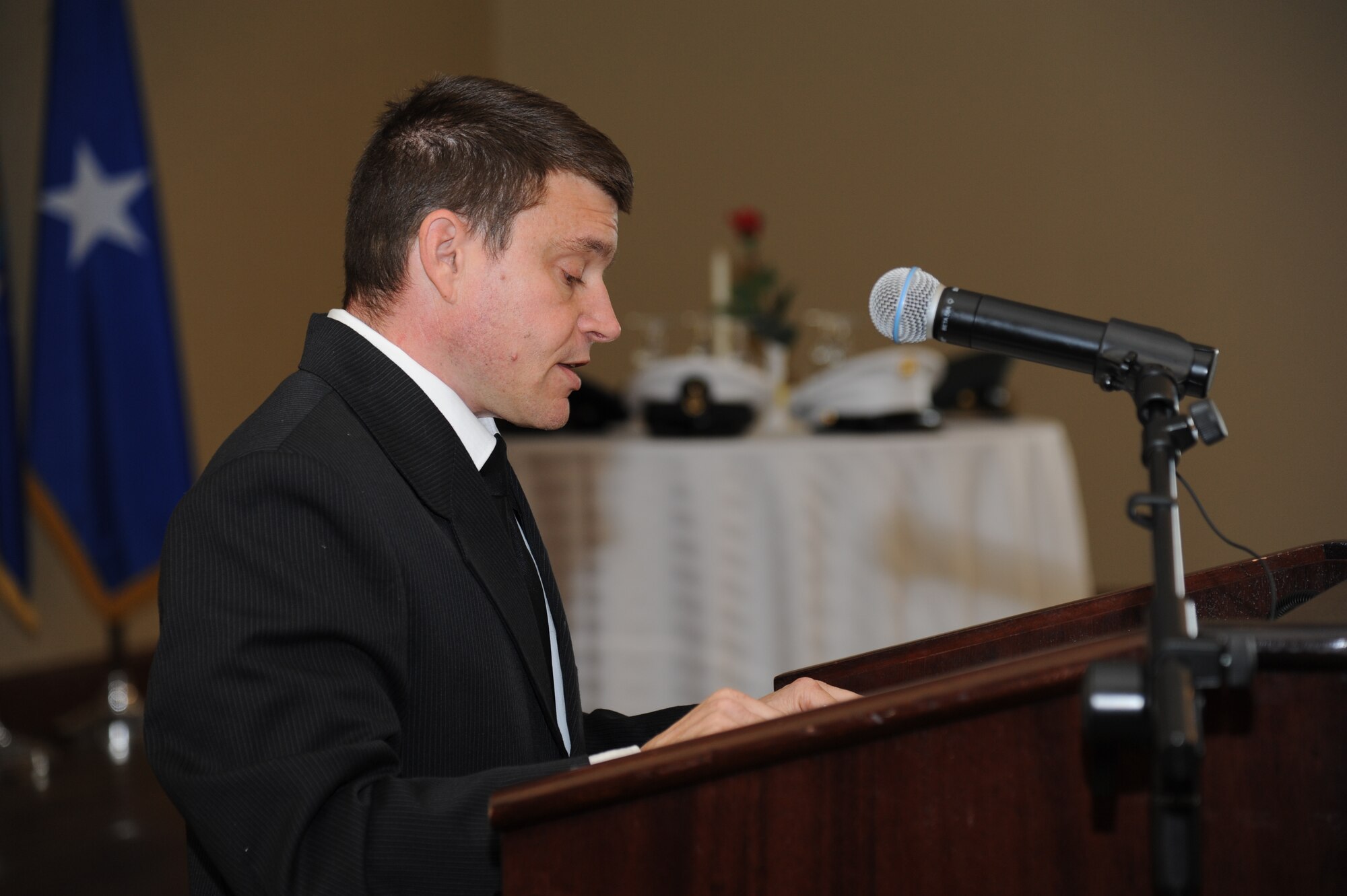 Michael Raff, 338th Training Squadron, reads a Hebrew scripture at the National Prayer Luncheon Feb. 20, 2013, at the Bay Breeze Event Center, Keesler Air Force Base, Miss.  The event included a ceremony by the Keesler Honor Guard to honor prisoners of war and those missing in action and guest speaker, retired Col. Richard Toliver. The annual event, a tradition that stems back to President Dwight D. Eisenhower in 1953, allows individuals of different faiths and backgrounds to join together to reflect and develop their spiritual fitness. This year’s theme was “Pray for America.”  (U.S. Air Force photo by Kemberly Groue)