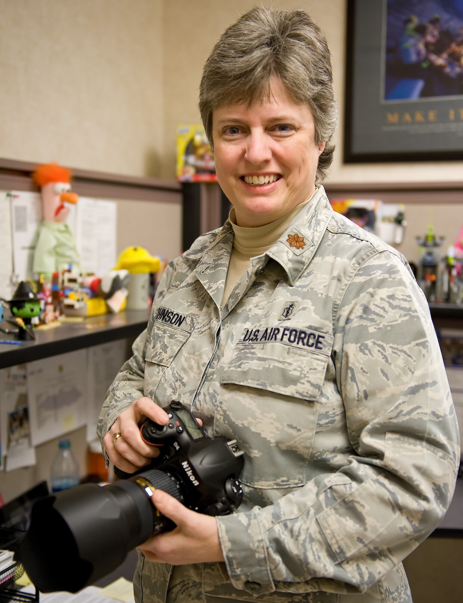 Maj. Julie Johnson, Clinical Laboratory Flight commander, 436th Medical Support Squadron, poses for a work place photo Feb. 20, 2013, at Dover Air Force Base, Del., Dover AFB Clinic Laboratory. Johnson was the 2012 Air Mobility Command award winner of the United States Air Force Biomedical Specialist Category I Officer of the Year (Field Grade Officer Category). (U.S. Air Force photo/Roland Balik)