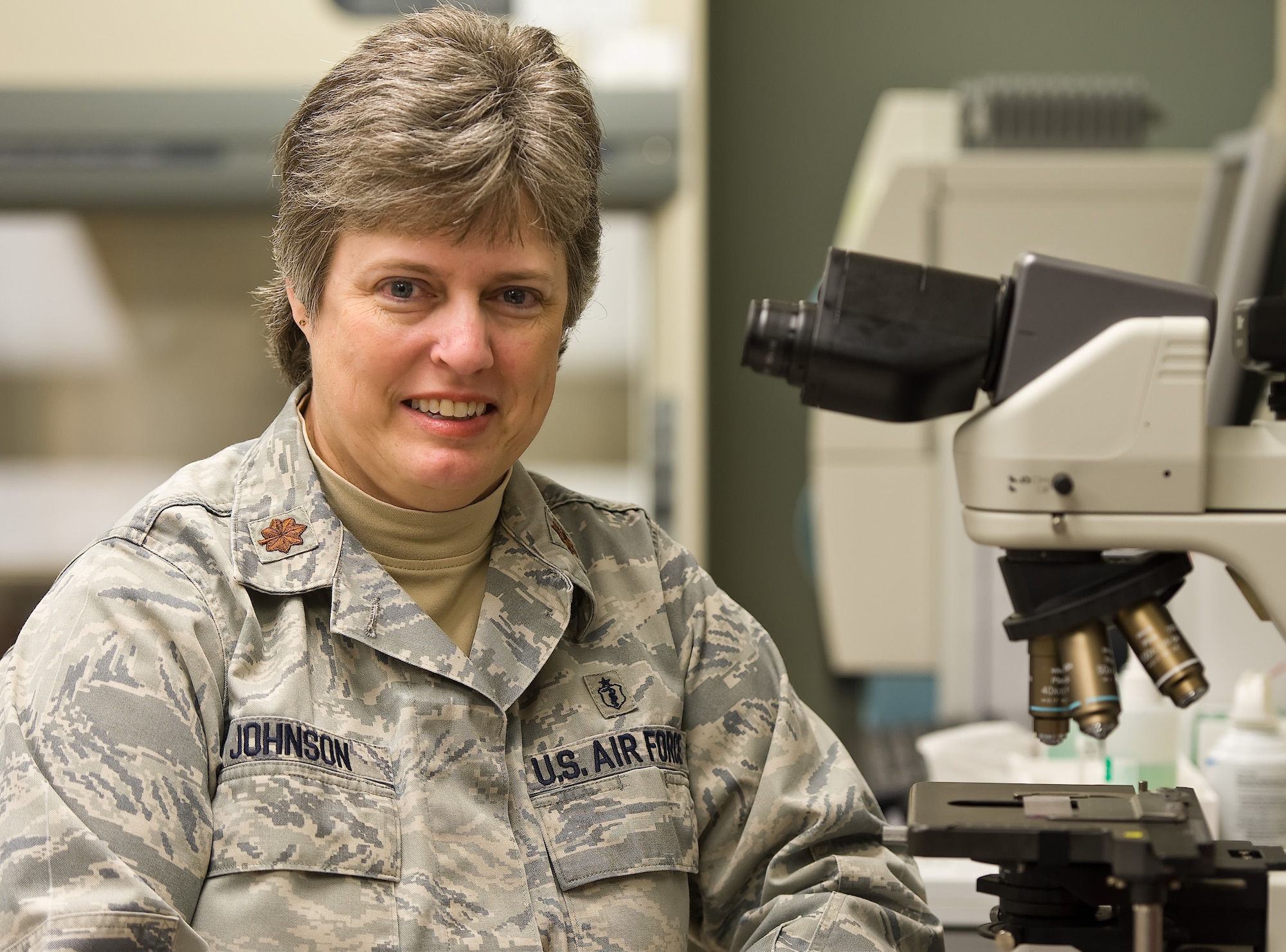 Maj. Julie Johnson, Clinical Laboratory Flight commander, 436th Medical Support Squadron, poses for a work place photo Feb. 20, 2013, at Dover Air Force Base, Del., Dover AFB Clinic Laboratory. Johnson was the 2012 Air Mobility Command award winner of the United States Air Force Biomedical Specialist Category I Officer of the Year (Field Grade Officer Category). (U.S. Air Force photo/Roland Balik)
