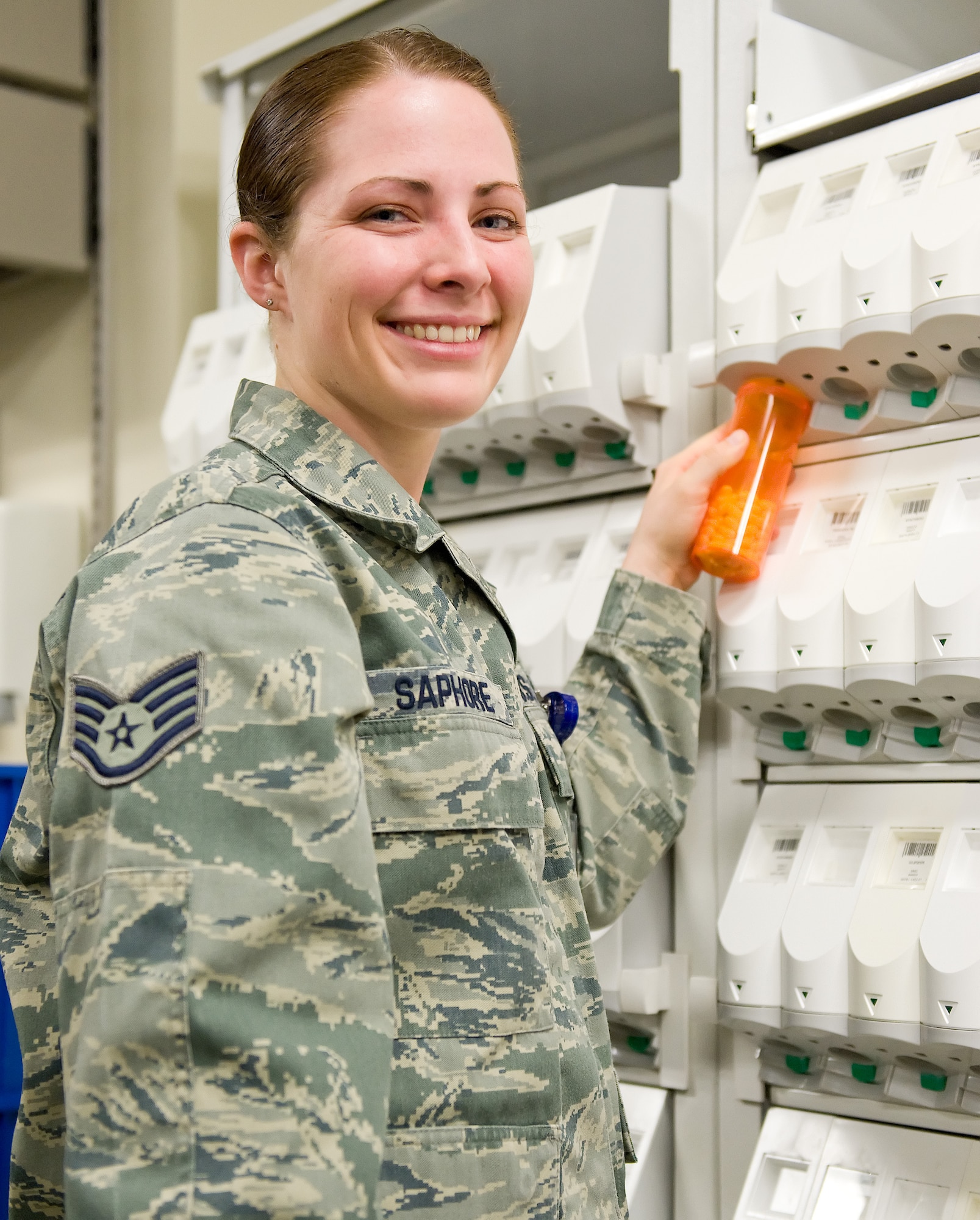Staff Sgt. Cassandra Saphore, a certified pharmacy technician with the 436th Medical Support Squadron, poses for a work place photo Feb. 20, 2013, at Dover Air Force Base, Del., Dover AFB Clinic Laboratory. Saphore was the 2012 Air Mobility Command award winner of the Outstanding Pharmacy Noncommissioned Officer Technician of the Year. (U.S. Air Force photo/Roland Balik)
