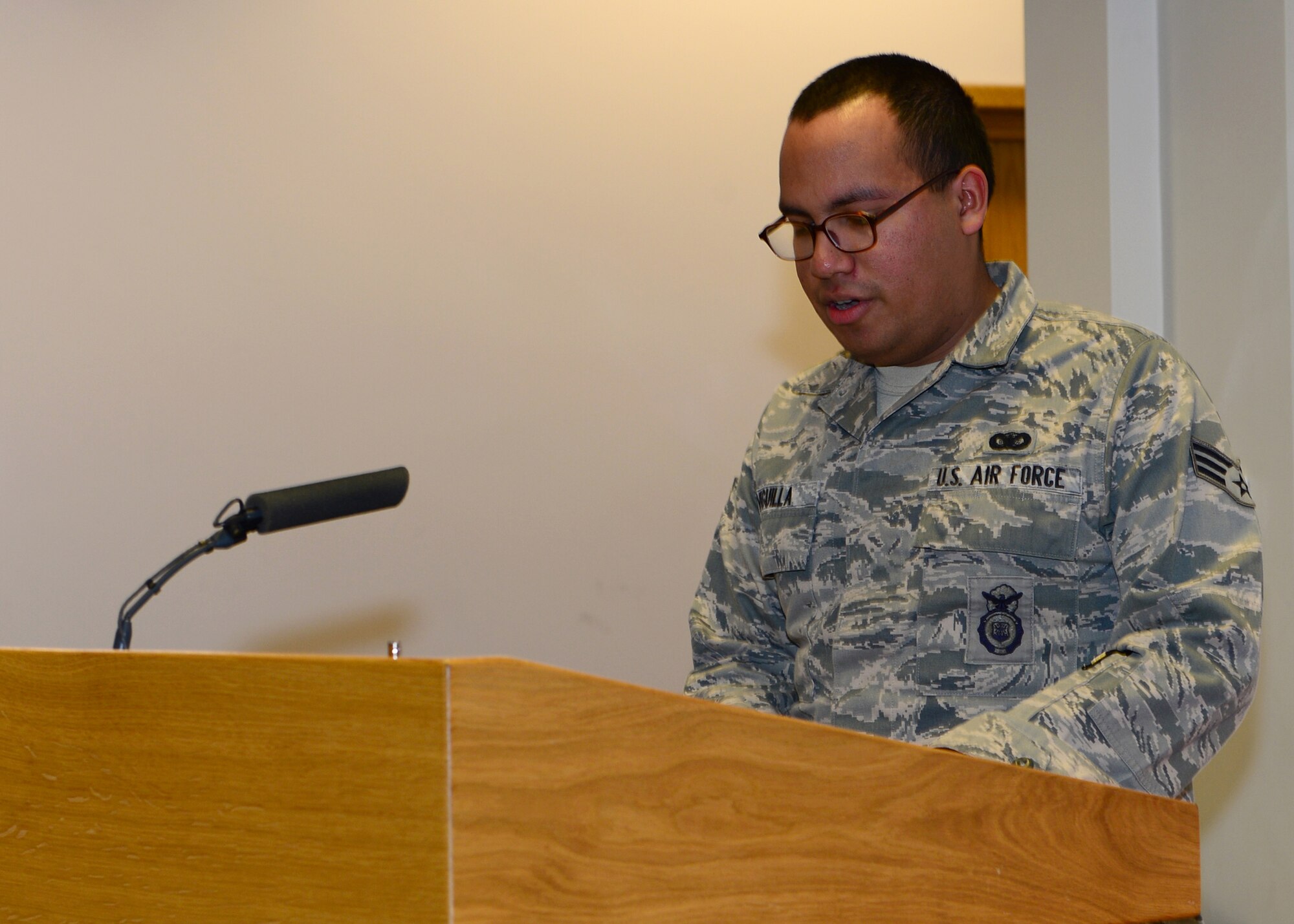 ROYAL AIR FORCE LAKENHEATH, England - Senior Airman Edgar Veguilla, 48th Security Forces Squadron patrolman, shares his experience during the New Horizons Wounded Warrior Support Program graduation ceremony Feb. 19, 2013. Veguilla is one of 14 Airmen who participated in the five-week support program. (U.S. Air Force photo by Staff Sgt. Stephanie Mancha)