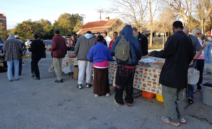 Members from the 17th Airlift Squadron volunteer their time as part of the Charleston Random Acts of Kindness Feb. 8, 2013, in downtown Charleston, S.C. The 17th AS has been supporting Charleston Random Acts of Kindness with the Feed a Friend Friday event for more than a year. Squadron members can be regularly seen serving on the food line when their flying schedules permit.  (Courtesy photo)
