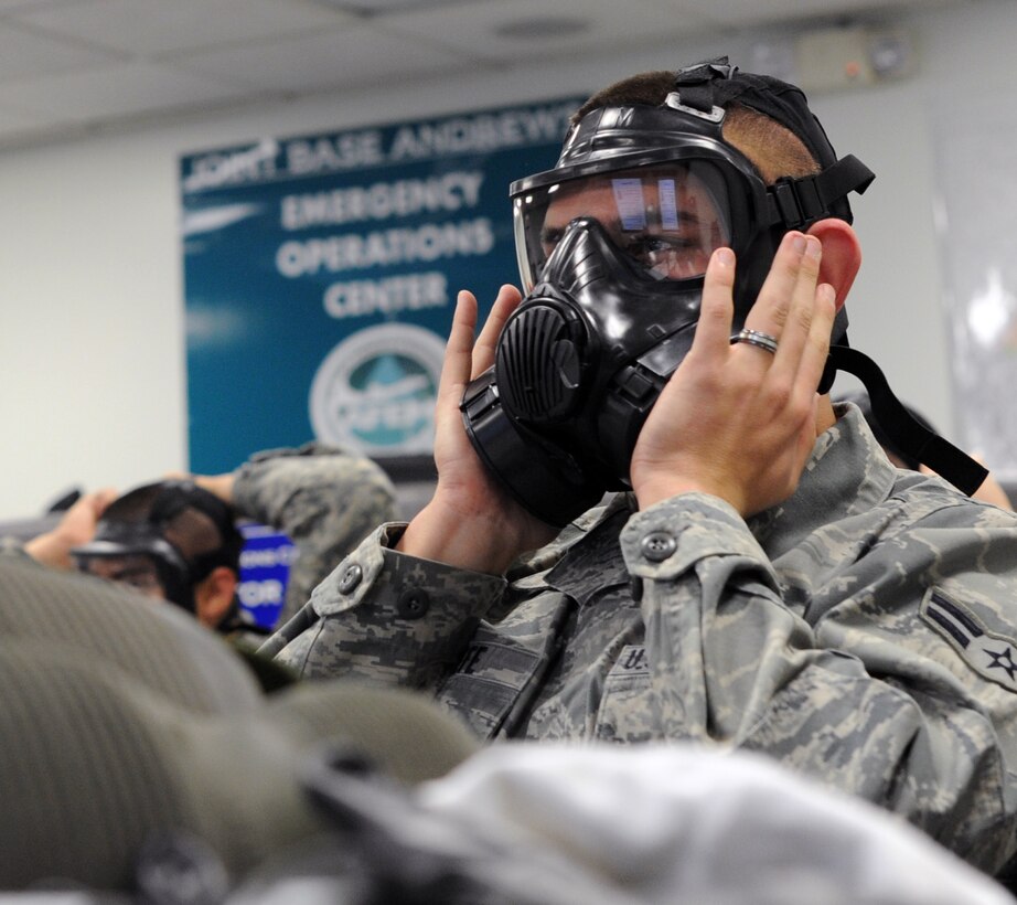 Airman 1st Class Ryan O'Keefe, 11th Civil Engineer Squadron heavy equipment operator, tries on an M50 gas mask during a Chemical, Biological, Radiological and Nuclear Defense (CBRN) Survival Skills Training course on Joint Base Andrews, Md., Feb. 14, 2013. The M50 is a Joint Service General Purpose Mask and is standard DOD wide, a vast improvement to the previous M40. (U.S. Air Force photo/Airman 1st Class Nesha Humes)(Released)
