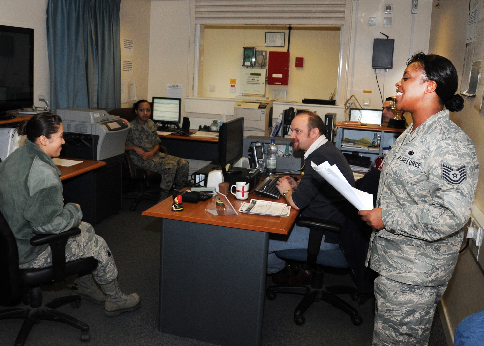 Tech. Sgt. Vivian Lewis, 100th Logistics Readiness Squadron hazardous materials pharmacy NCO-in-charge from Vancouver, Wash., gives a morning safety briefing Feb. 20, 2013, at RAF Mildenhall, England. The shop provides hazardous material storage and usage to authorized customers. (U.S. Air Force photo by Gina Randall/Released)
