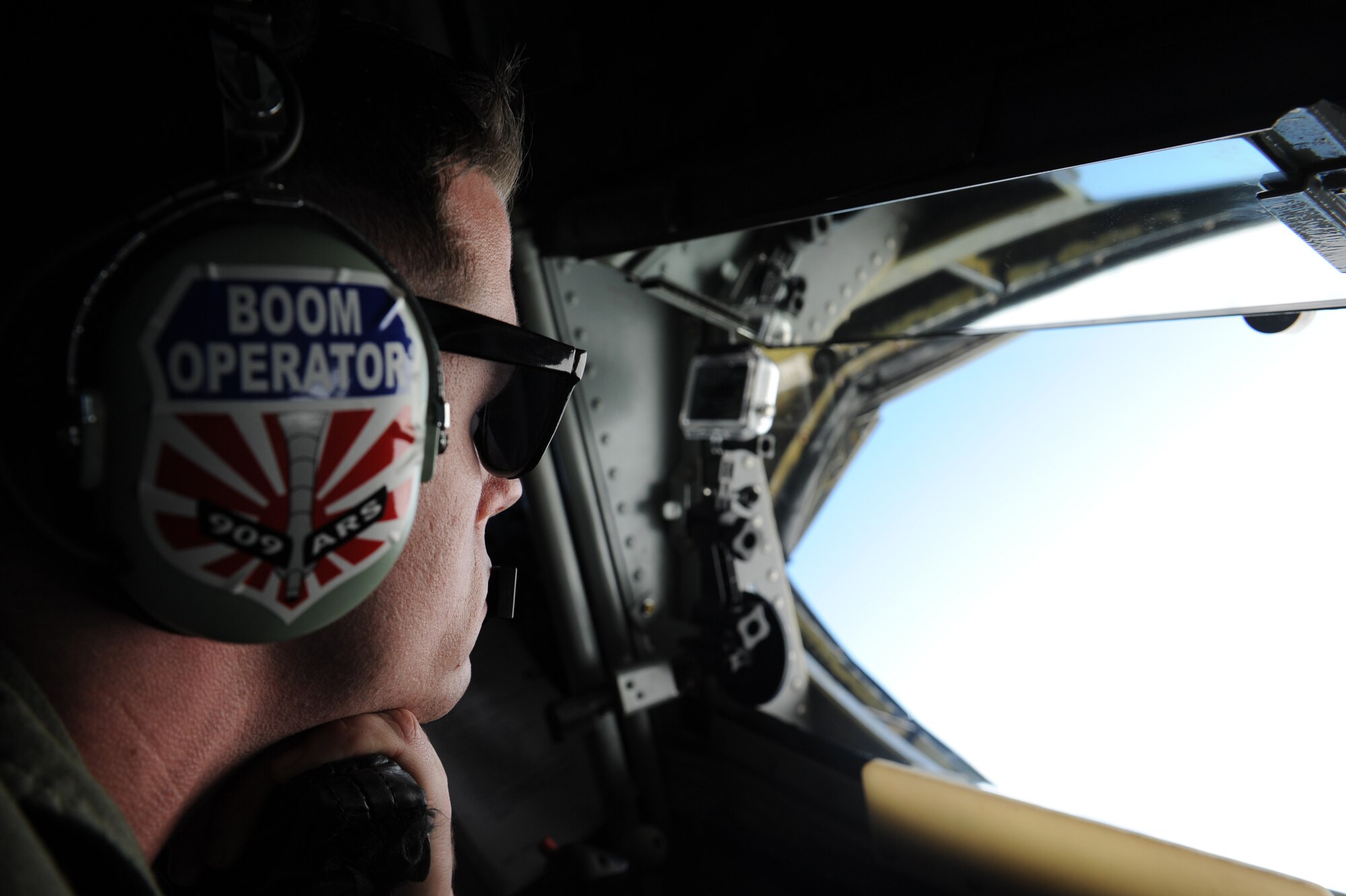 U.S. Air Force Airman 1st Class Matthew O’Daniel, 909th Air Refueling Squadron boom operator, prepares to refuel an F-22 Raptor fighter jet during a training sortie near Kadena Air Base, Japan, Feb. 19, 2013. Raptors from Joint Base Langley-Eustis, Va., are deployed to Kadena to demonstrate the continued U.S. commitment to fulfill security responsibilities throughout the Western Pacific and to maintain peace in the region. (U.S. Air Force photo/Airman 1st Class Malia Jenkins)