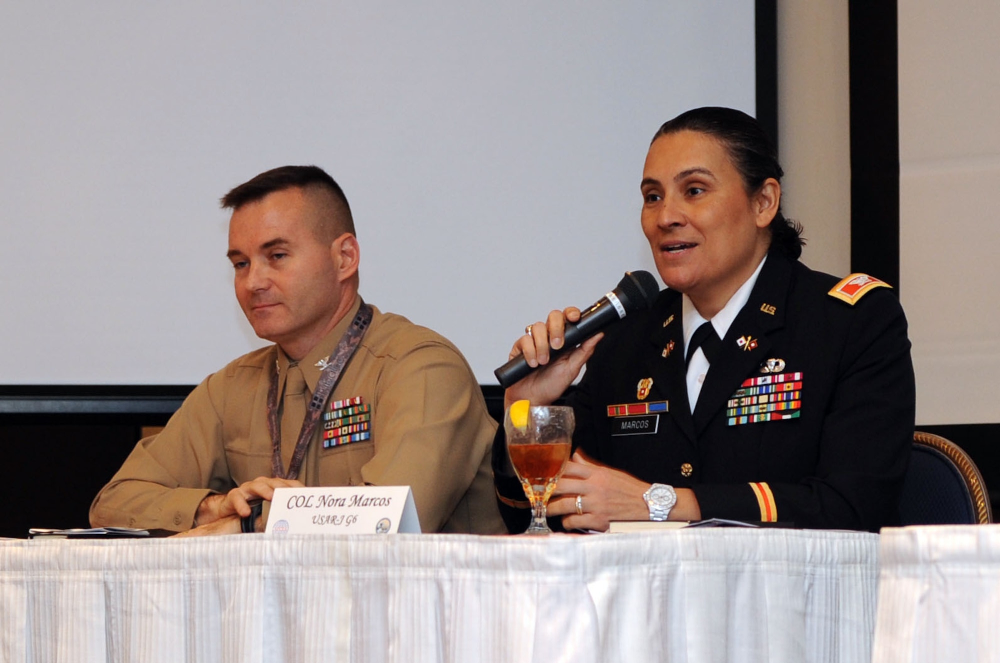 TOKYO, Japan -- Right, Col. Nora Marcos, U.S. Army Japan deputy chief of staff, G-6, answers a question from the audience at the 7th Annual Armed Forces Communications and Electronics Association TechNet Tokyo, Feb. 13, 2013, at the New Sanno Hotel in Tokyo, Japan. Marcos, and other military technology leaders from the Pacific, discussed the future of the military’s role in the region as part of the Western rebalance. (U.S. Air Force photo by Airman 1st Class Desiree Economides)