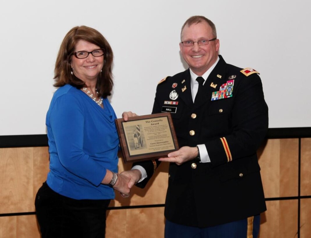 U.S. Army Col. Jeff Hall, commander of the U.S. Army Corps of Engineers Savannah District, presents Carol Abercrombie with the 2013 James Connolly Award at the Savannah E-Week Technical Training Conferenc in Savannah, Ga., Feb. 19, 2013. (U.S. Army photo by George Jumara/Released)