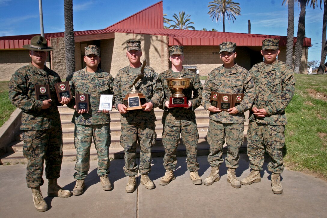 Marines with Weapon Field Training Battalion, display their awards earned from the 2013 Depot Competition in Arms at Edson Range aboard Marine Corps Base Camp Pendleton, Calif. Feb. 15. WFTBn. hosted the DCIAP intramural rifle and pistol matches in order to promote advanced marksmanship skills and identify potential members for the Marine Corps Recruit Depot shooting team to take part in the Western Division Matches.