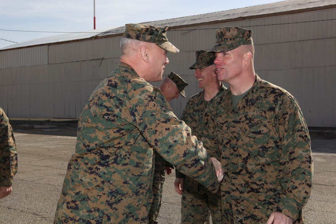 The Assistant Commandant of the Marine Corps, Gen. John M. Paxton, Jr. greets Sgt. Maj. Potss, during a visit to Marine Corps Logistics Command, Albany, GA,  Feb. 21, 2013. The trip was part of a larger visit with Marines aboard installations under Marine Corps Logistics Command (LOGCOM) and Marine Corps Systems Command. (U.S. Marine Corps photo by Cpl. Tia Dufour/Released)