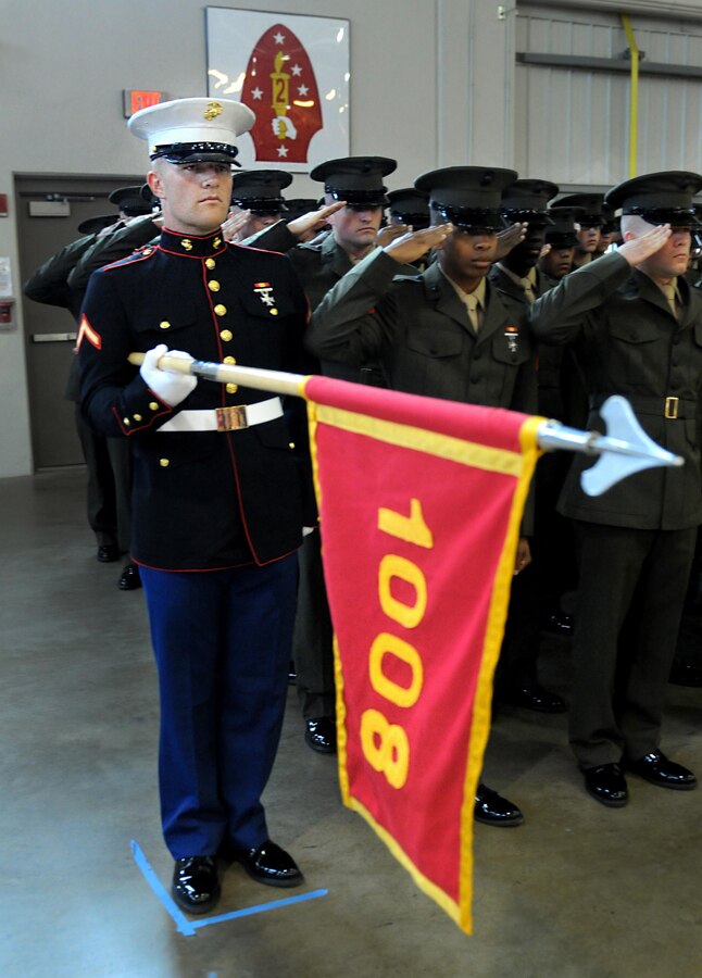 Pfc. Casey N. Dodd, honor graduate of platoon 1008, presents his platoon guidon during graduation aboard Parris Island, S.C., Feb. 22, 2013. Dodd, a native of Alto, Ga., was recruited by SSgt. Mitchell Hamilton of Recruiting Substation Gainesville, Recruiting Station Atlanta. After graduation, Dodd will be able to go home for some much deserved leave followed by additional training to become an Aviation Crew Chief. (Official U.S. Marine photo by Cpl Gabrielle Bustos)
