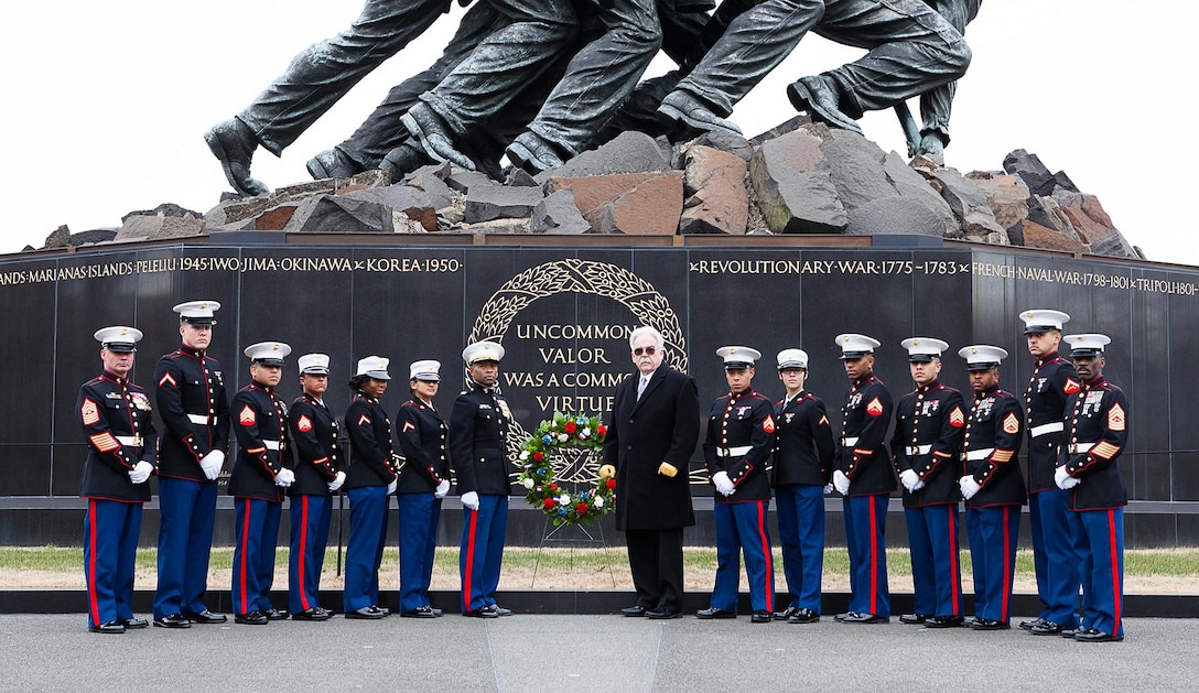 Marines from Headquarters and Service Battalion, Headquarters Marine Corps, Henderson Hall pose with Marine Corps War Memorial Foundation founder James P. Donovan after a wreath laying ceremony to recognize the 68th anniversary of the Battle for Iwo Jima Feb. 22. The Marine Corps War Memorial depicts a photograph taken during the battle by Joe Rosenthal, of Marines and a Navy corpsman raising the American flag Feb. 23, 1945. The memorial honors all Marines who have given their lives in service to their country.

