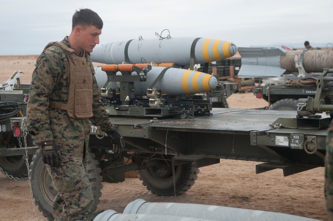 A Marine Aviation Logistics Sqaudron 13 ordnance explosive specialists performs a maintenance check on freshly made Mark 82's as a part of the Integrated Training Exercise at Marine Air Ground Combat Center Twentynine Palms in January 2013.