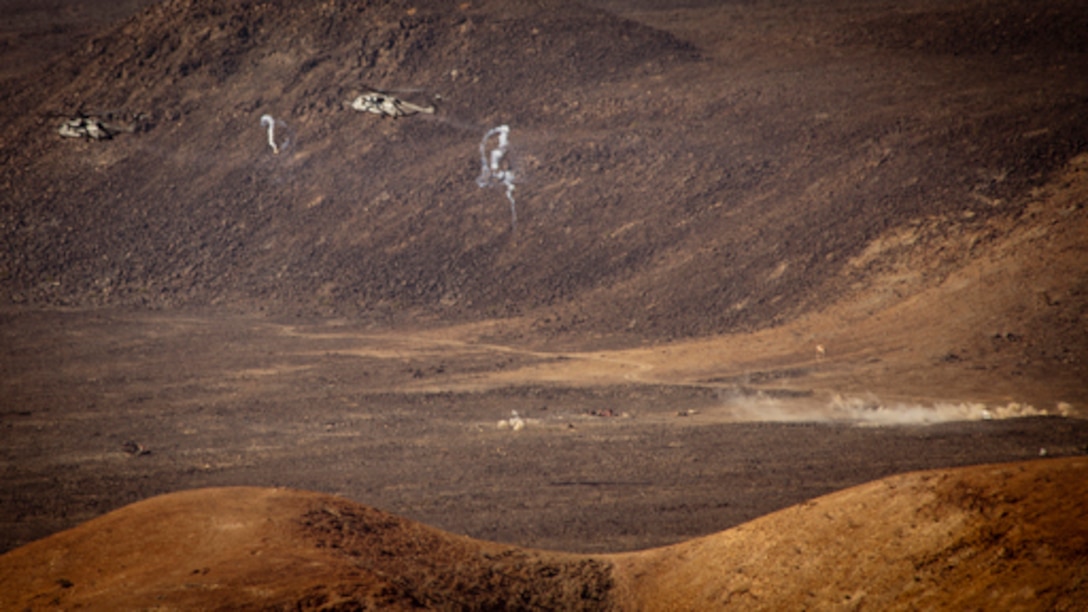 U.S. Marine Corps CH-53E Super Stallions from Marine Medium Helicopter (HMM-364 REIN) fire off flares and conduct live fire gun runs on designated range targets on Djibouti training impact area AR-11, Djibouti, February 11, 2013.  The 15th MEU is conducting sustainment training on various ranges throughout the host nation in preparation for any real world crisis.  (U.S. Marine Corps photo by: Master Sgt John A. Lee, II. /Released)