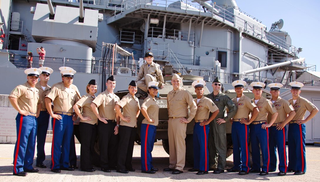 USS MISSOURI BATTLESHIP MEMORIAL - Marines with Combat Logistics Battalion 3 and Hawaii-based sailors pose for a photo with Carl Hornbeak Hess (center on tank) in front of the USS Missouri Battleship Memorial while fulfilling his dream in partnership with the Make-A-Wish Foundation, Feb. 15. Hornbeak-Hess, an 11-year-old boy from Mill Creek, Wash., who has been diagnosed with acute lymphoblastic leukemia, dreamed of becoming a World War II Army Air Corps pilot whose aircraft is shot down and crash lands on a deserted island. He was granted his wish from Feb. 15 to 19 with the help of Hawaii-based Marines, sailors and the Make-A-Wish Foundation. (U.S. Marine Corps photo by Lance Cpl. Nathan Knapke/Released) 
