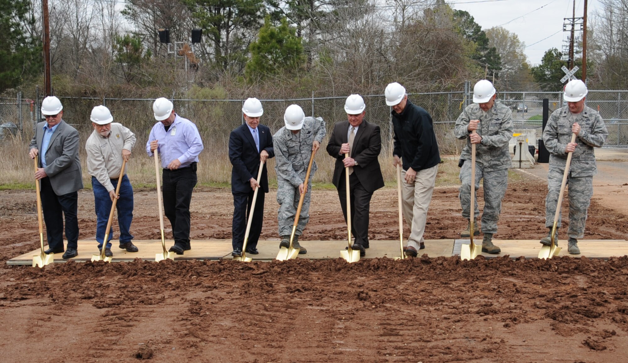 Team Barksdale members, along with local leaders from the surrounding community attend the Bodcau Gate ground breaking ceremony on Barksdale Air Force Base, La., Feb. 22. The gate will be a silent gate meaning trains will not have to blow their horn when crossing through, eliminating the noise level to residents living on the East Reservation. The gate will also reduce the time it takes for children to get to Bossier City schools. (U.S. Air Force photo/Senior Airman Sean Martin)