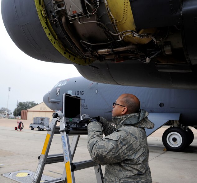 Staff Sgt. Dominique West, 20th Aircraft Maintenance Unit, looks over a technical order on Barksdale Air Force Base, La., Feb. 22. TO's are step-by-step instruction manuals used by maintenance Airmen that list proper tools needed, any hazards to be aware of and protective gear to accomplish the task. (U.S. Air Force photo/Airman 1st Class Andrew Moua)