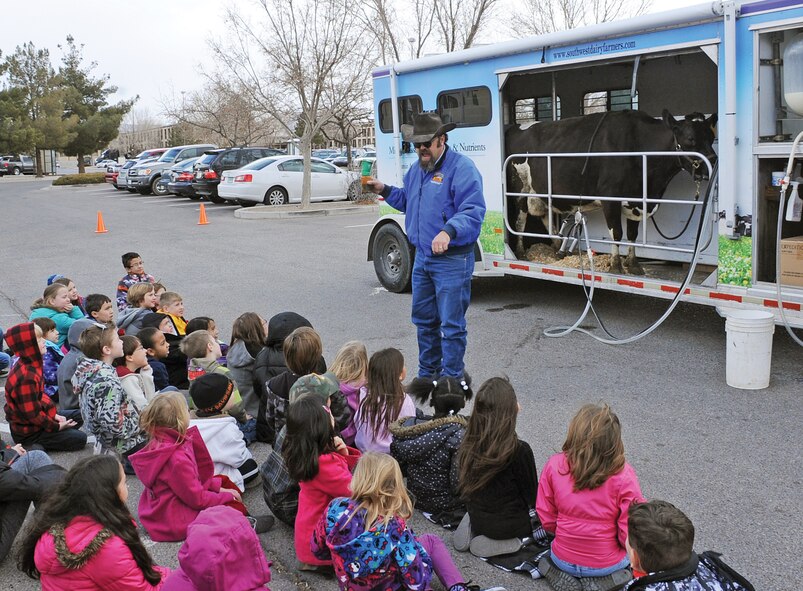 Cody Lightfoot explains the process of milking a cow during a mobile classroom dairy education event Feb. 20 at the Kirtland AFB Youth Center. 