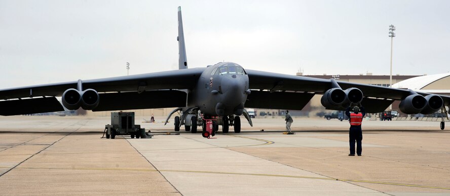 Airmen assigned to the 20th Aircraft Maintenance Squadron direct a B-52H Stratofortress to a parking space on Barksdale Air Force Base, La., Feb. 22. The B-52s ability to project global power has been a mainstay of U.S. airpower for more than 60 years, from delivering precision munitions to the battlefield or providing close air support. (U.S. Air Force photo/Airman 1st Class Andrew Moua)