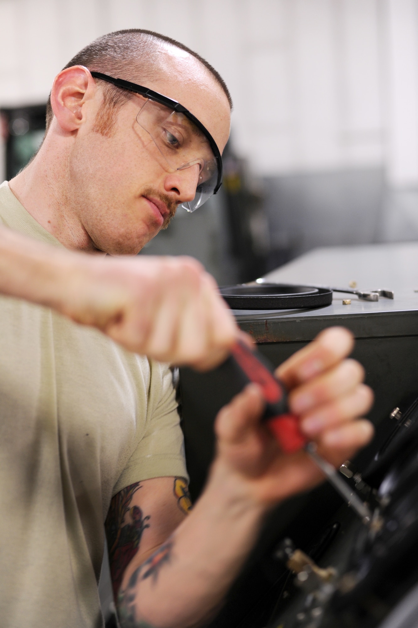 U.S. Air Force Senior Airman Robert Kitchens, 354th Maintenance Squadron aerospace ground equipment mechanic, installs a blower pressure gauge on a cabin leakage tester Feb. 5, 2013, Eielson Air Force Base, Alaska. The cabin leakage tester provides a means of pressurizing and automatically measuring the leakage rate of an aircraft cabin. (U.S. Air Force photo/Staff Sgt. Jim Araos)