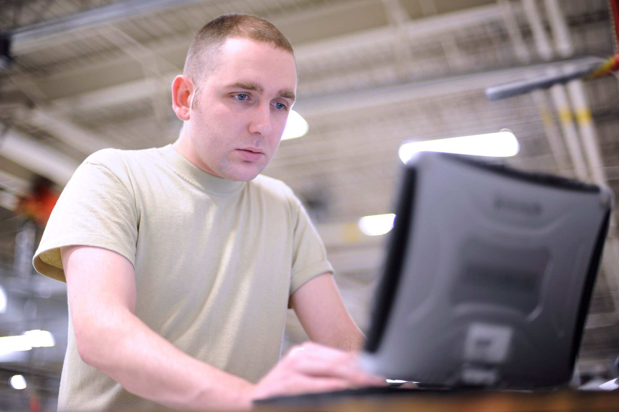 U.S. Air Force Airman 1st Class Harold England, 354th Maintenance Squadron aerospace ground equipment mechanic, searches through a data base for technical orders on maintenance procedures Feb. 5, 2013, Eielson Air Force Base, Alaska. An Air Force technical order is a publication that explains policies and procedures on how to perform maintenance properly. (U.S. Air Force photo/Staff Sgt. Jim Araos)