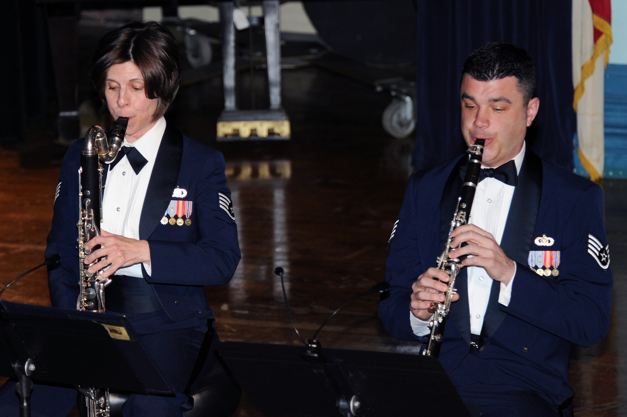 U.S. Air Force Staff Sgts. Cynthia Ramirez and Jeffrey Boehmer, members of the U.S. Air Force Heritage of America’s Langley Winds, perform during a live concert at Goldsboro High School, Goldsboro, N.C., Feb. 16, 2013. The band plays at classical recitals, school assemblies and official military functions. (U.S. Air Force photo/Airman 1st Class John Nieves Camacho/Released)