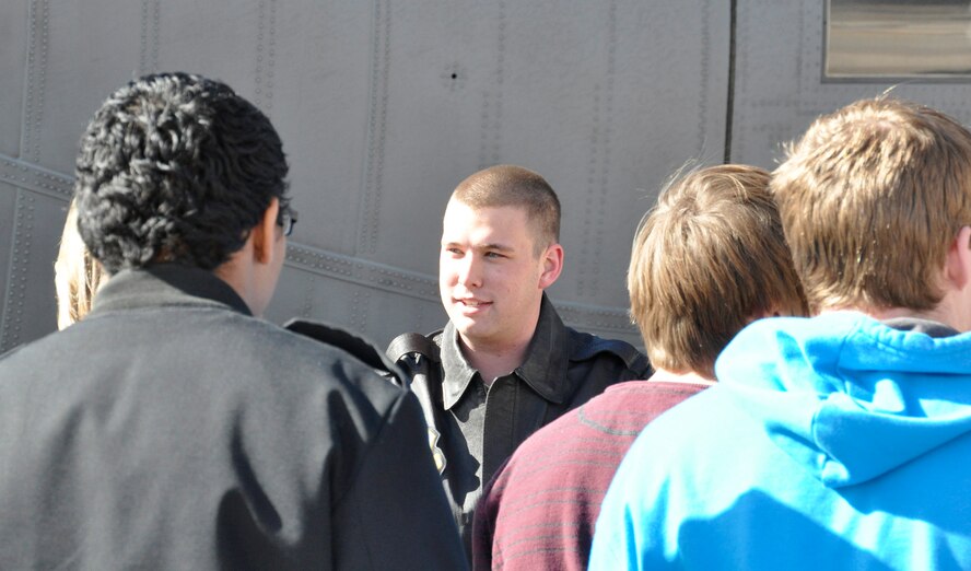 PETERSON AIR FORCE BASE, Colo. Senior Airman Tristian Lyons, a 52nd Airlift Squadron loadmaster, shows students from the Cherry Creek Schools Aviation Technology Program around a C-130 aircraft during a tour Feb. 14 here. The students make the annual trip to Peterson and the Air Force Reserve Command’s 302nd Airlift Wing to get a realistic view of what it is like to be a military aircrew member. Besides a tour of the aircraft, the students were given a mission brief, a survival, evasion, resistance and escape brief, and a tour of the base museum. More than sixty students participated in two tours this year. (U.S. Air Force photo/Tech. Sgt. Daniel Butterfield) 