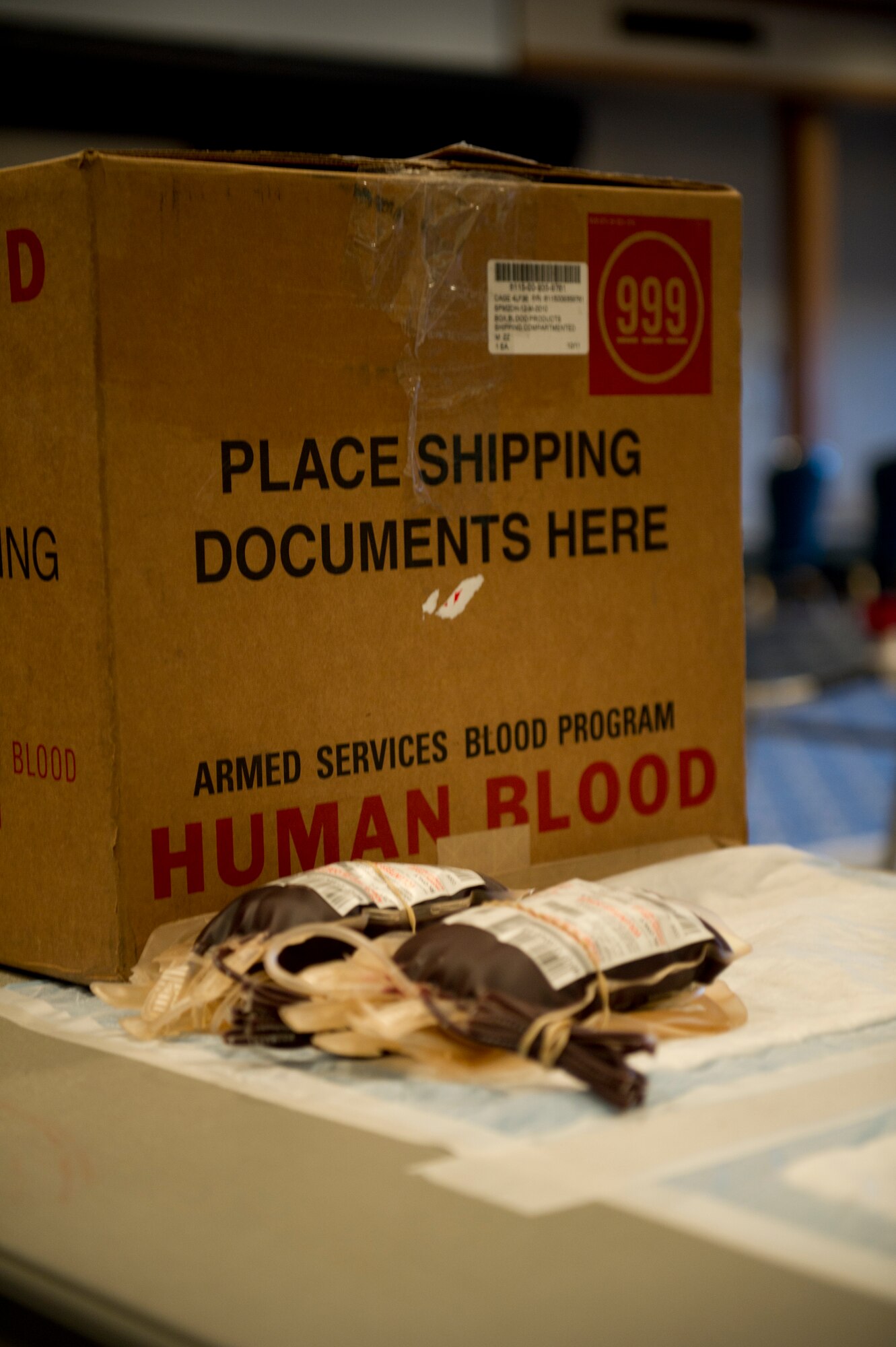 Two units of blood sit ready for packing during an Armed Services Blood Program blood drive at Holloman Air Force Base, N.M., Feb. 20. The ASBP provides blood products for service members and their families in situations when a service member injured in action, a child with cancer, or a family member is in need of heart surgery. Holloman AFB donated 32 units of blood during the drive. One donation can save three lives. (U.S. Air Force photo by Senior Airman Kasey Close/Released)