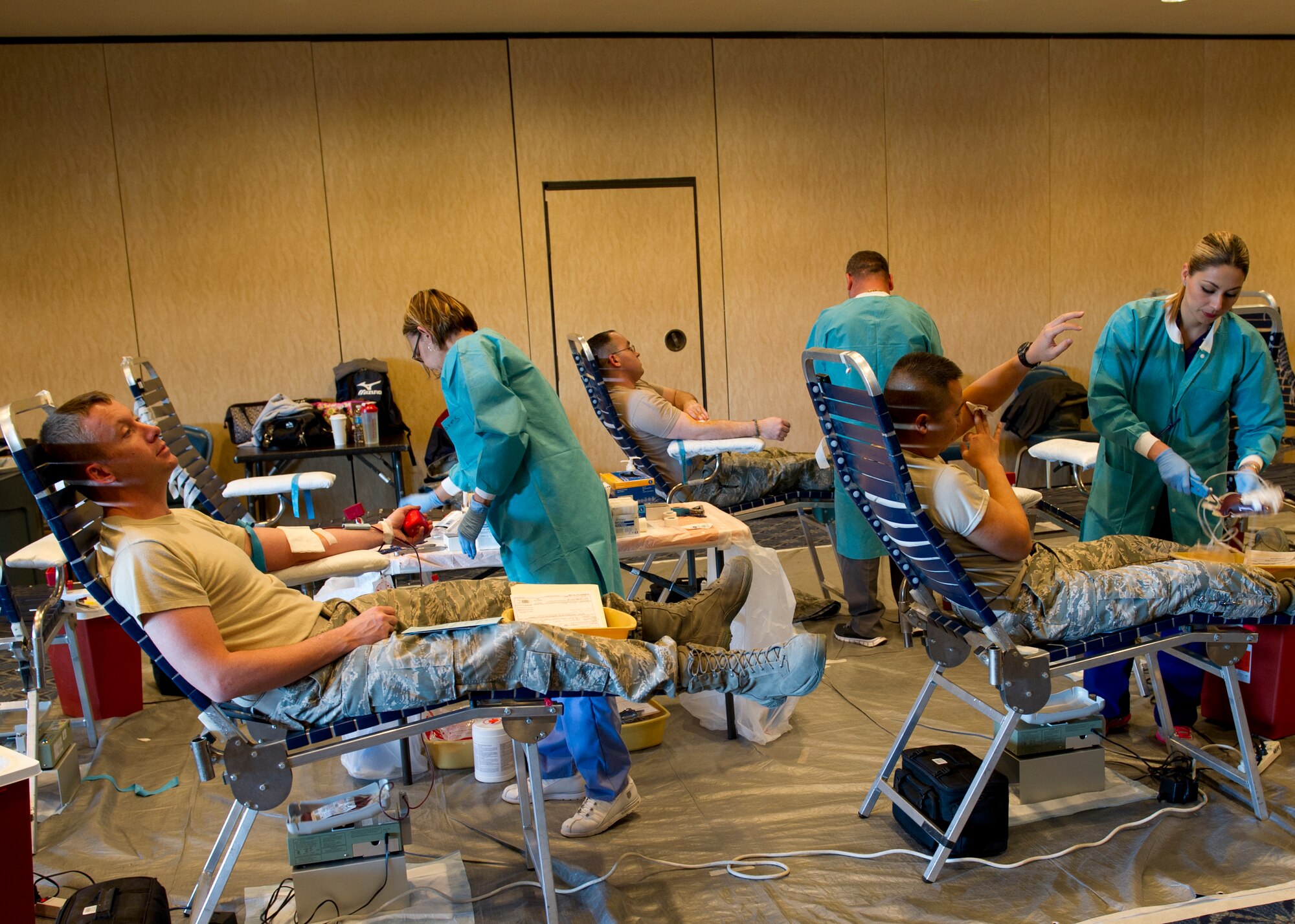 William Beaumont Army Medical Center medical technicians take blood donations from Airmen during an Armed Services Blood Program blood drive at Holloman Air Force Base, N.M., Feb. 20. Holloman AFB donated 32 units of blood during the drive. One donation can save three lives. (U.S. Air Force photo by Senior Airman Kasey Close/Released)