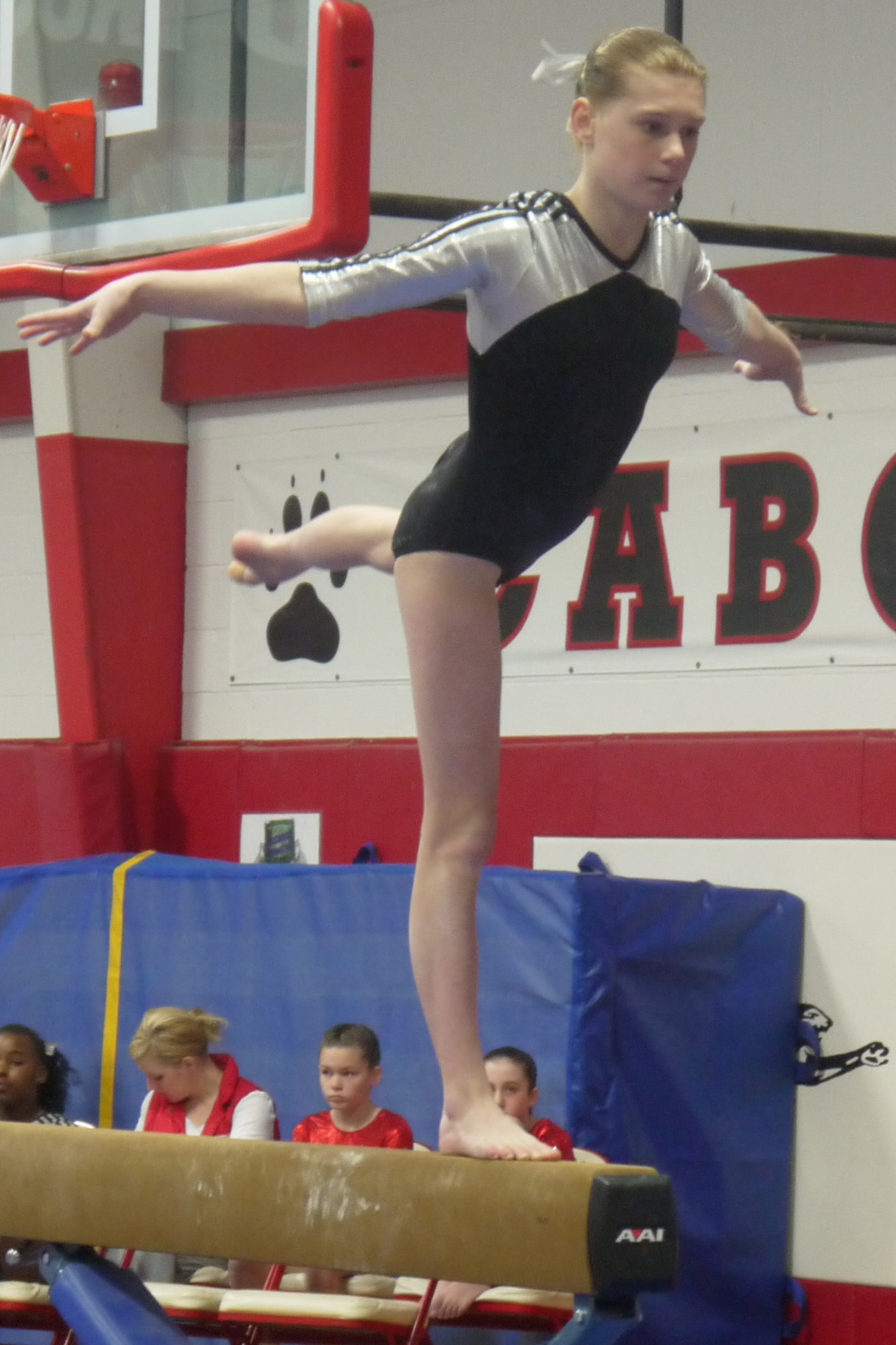 Renae Suberly, daughter of Maj. Michael Suberly, 8th Air Force Office of the Staff Judge Advocate, and Maj. Michelle Suberly, Air Force Global Strike Command Office of the Staff Judge Advocate, competes on the balance beam during the Emerald Classic Feb 16-17 in Cabot, Ark.