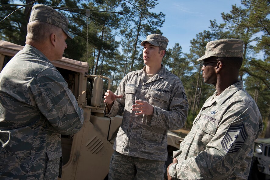 U.S. Air Force Tech. Sgt. Brent Davidson (center), 15th Air Support Operations Squadron joint terminal attack controller out of Ft. Stewart, Ga., speaks with Maj. Gen. Lawrence Wells (left), 9th Air Force commander, and Chief Master Sgt. James Davis, 9th AF command chief, Feb. 21, 2013, at Moody Air Force Base, Ga. Davidson, a master sergeant select, spoke about his deployment experiences and his expectations after he sews on his new rank. (U.S. Air Force photo by Staff Sgt. Jamal D. Sutter/Released)