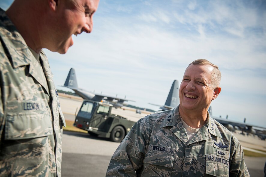 U.S. Air Force Maj. Gen. Lawrence Wells, 9th Air Force commander, shares laughs with Chief Master Sgt. Jeffery Leemon, 71st Aircraft Maintenance Unit superintendent, Feb. 20, 2013, at Moody Air Force Base, Ga. Wells and Leemon spoke about Moody's upcoming integration of the C-130J Super Hercules and what the 71st AMU is doing in preparation for the addition. (U.S. Air Force photo by Staff Sgt. Jamal D. Sutter/Released)