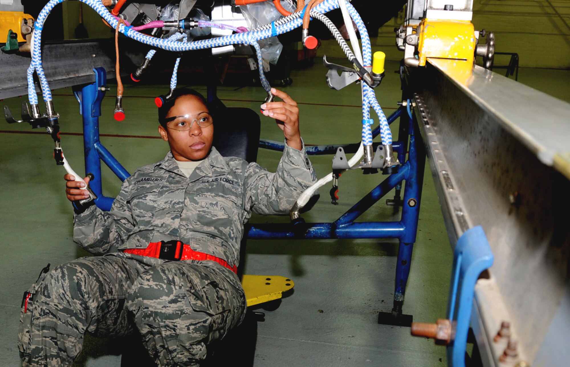 Tech. Sgt. Rachel Chambers, 192nd Fighter Wing Jet Engine Intermediate Maintenance jet propulsion technician, carefully inspects an F-22 engine connector cables Feb. 10, 2013 in preparation for a Logistics Compliance Assessment Program evaluation.  The LCAP provides leadership with an assessment of the unit's ability to perform key logistics processes in a safe, standardized, repeatable and technically compliant manner.  (U.S. Air Force photo by Master Sgt. Carlos J. Claudio/Released)