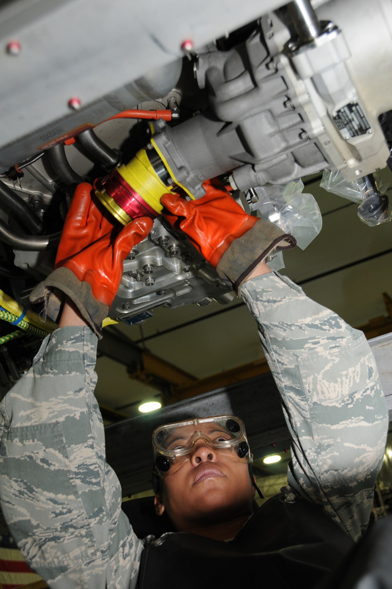 Tech. Sgt. Rachel Chambers, 192nd Fighter Wing Jet Engine Intermediate Maintenance jet propulsion technician, carefully inspects an F-22 engine Feb. 10, 2013 in preparation for a Logistics Compliance Assessment Program evaluation.  The inspection is based on a graded assessment with percentage scores and uses the five-tier rating scale, ranging from outstanding down through excellent, satisfactory, marginal and unsatisfactory.  (U.S. Air Force photo by Master Sgt. Carlos J. Claudio/Released)