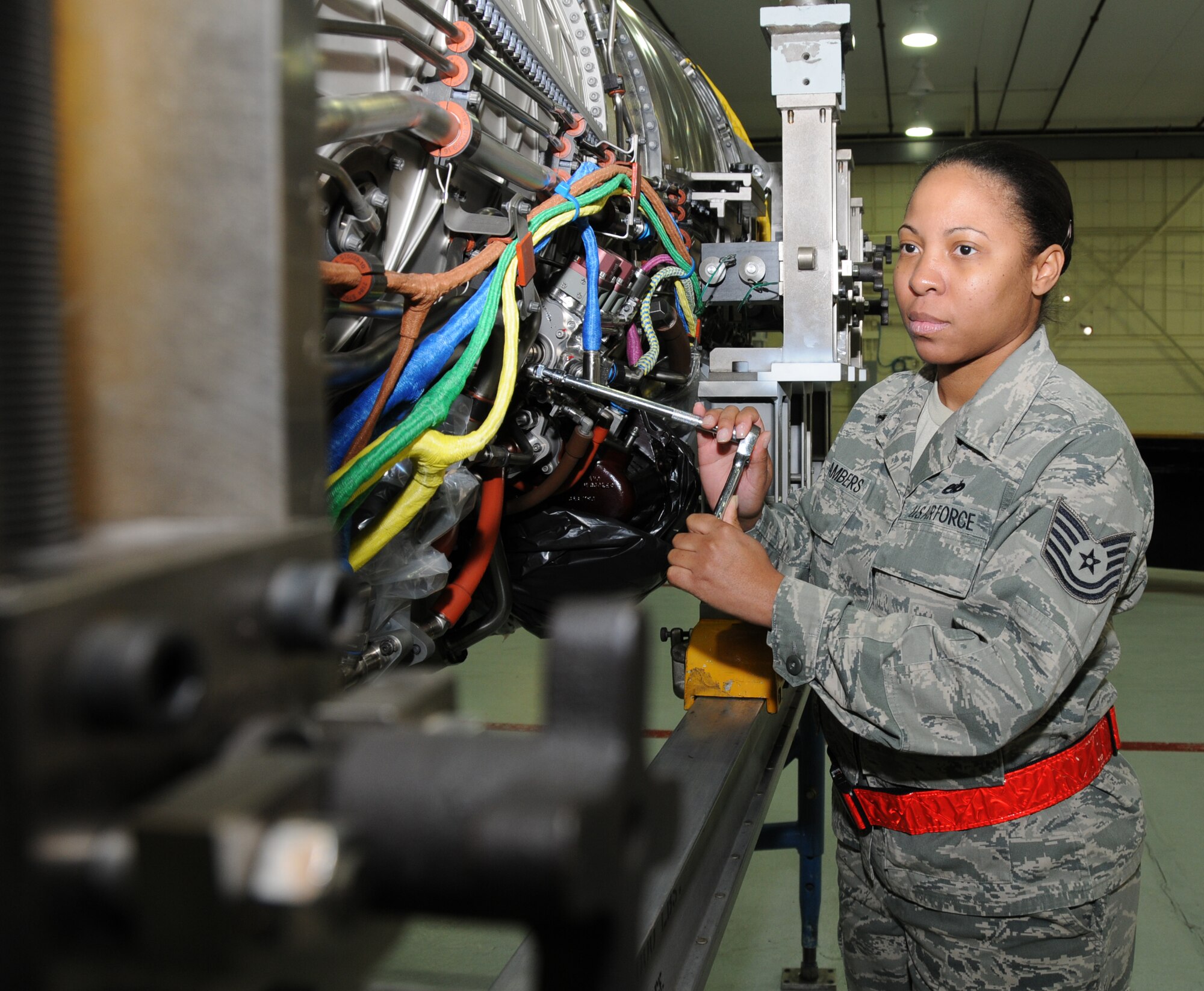 Tech. Sgt. Rachel Chambers, 192nd Fighter Wing Jet Engine Intermediate Maintenance jet propulsion technician, inspects an F-22 engine Feb. 10, 2013 in preparation for a Logistics Compliance Assessment Program evaluation. The inspection is based on a graded assessment with percentage scores and uses the five-tier rating scale, ranging from outstanding down through excellent, satisfactory, marginal and unsatisfactory. (U.S. Air Force photo by Master Sgt. Carlos J. Claudio/Released)