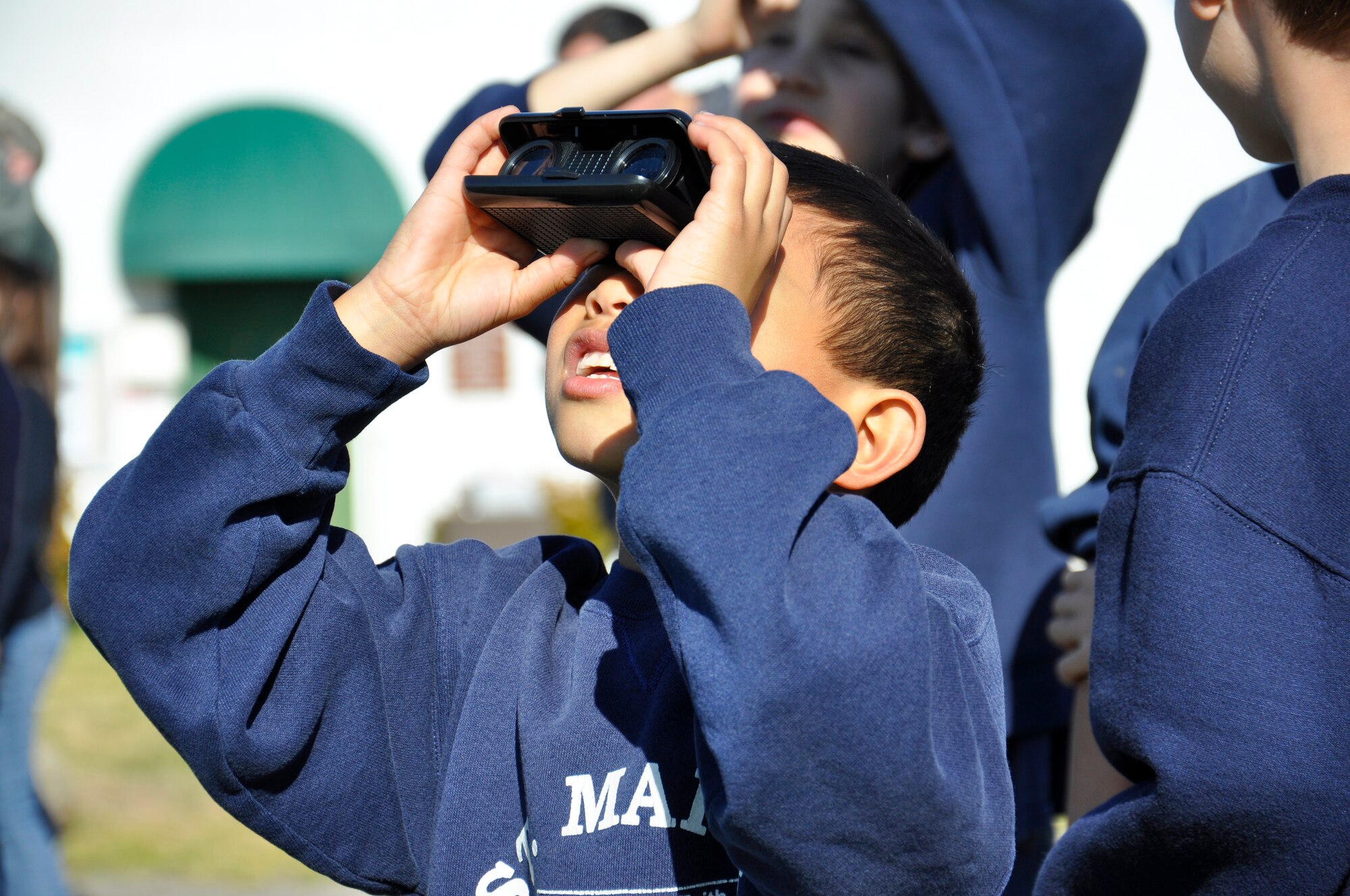 Luke Vibal, a first-grade student at St. Mary of the Assumption School in Santa Maria, Calif., watches a United Launch Alliance Atlas V rocket blast into orbit carrying a NASA payload. Students from St. Mary's visited the base as part of a science field trip Feb. 11, 2013. Luke is the son of Natalie and Capt. Ludell Vibal, a launch mission manager. (U.S. Air Force
Photo/Maj. Stacie N. Shafran)


