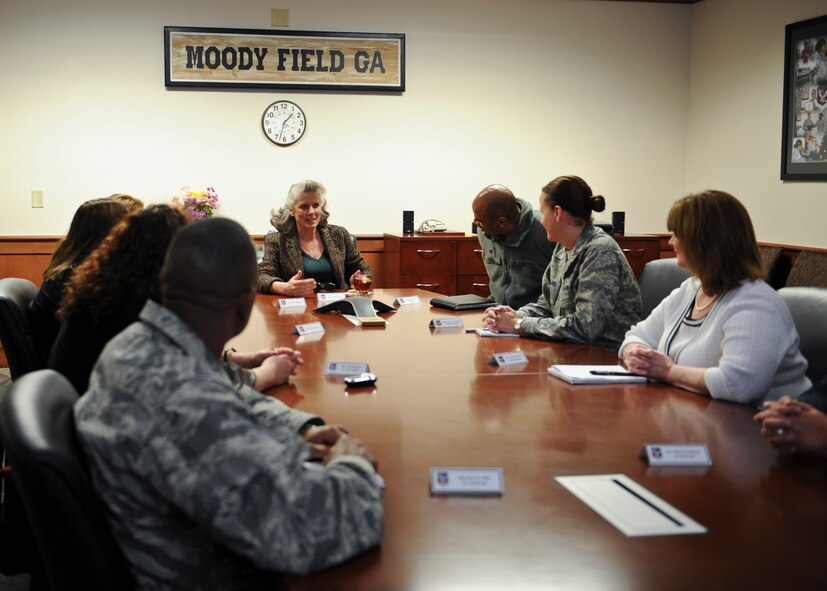 Kathy Wells, wife of U.S. Air Force Maj. Gen. Lawrence Wells, 9th Air Force commander, meets with Col. Edward Ford, 23d Mission Support Group commander, and representatives of resiliency programs at Moody Air Force Base, Ga., Feb. 20, 2013. Kathy Wells also attended a Key Spouse meeting and toured various parts of base to see how Airmen were doing. (U.S. Air Force photo by Senior Airman Eileen Meier/Released) 
