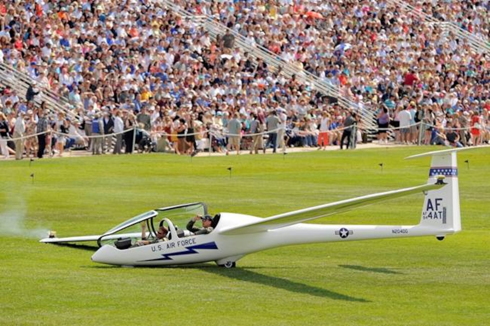 A TG-16, used by the 94th Flying Training Squadron to conduct the U.S Air Force Academy's soaring airmanship program, lands on the Academy's parade field following a demonstration. The 94th FTS conducts more than 16,000 training and competition soaring sorties annually using 24 TG-15 and TG-16 aircraft.  The squadron focuses on developing officership, leadership and character in the more than 1,600 Academy cadets who go through its program each year. (Courtesy photo)