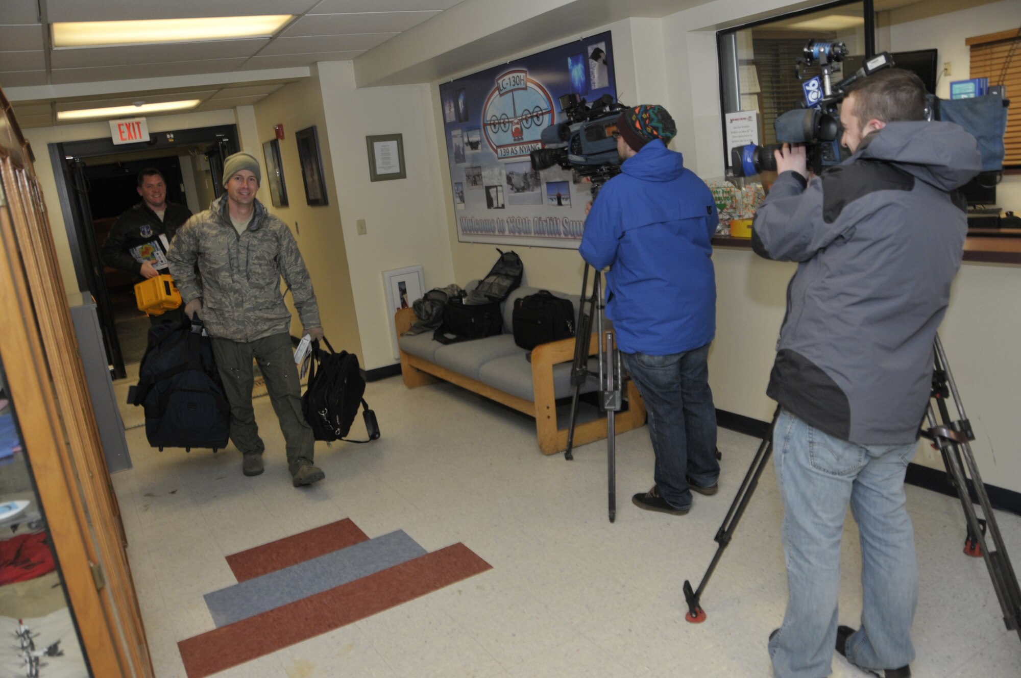 Maj Joshua Hicks, a pilot with the 109th Airlift Wing, New York Air National Guard, arrives home after flying an LC-130 aircraft from Antarctica back to New York.  The wing has just completed its 24th year supporting National Science Foundation operations throughout the continent of Antarctica.  (U.S. Air Force photo by MSgt. Willie Gizara/Released)