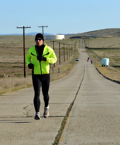 Runners of the Recce Challenge Adventure Series Duathlon Race run the approximate three mile portion of the race at Beale Air Force Base, Calif., Feb. 21, 2013. Competitors had to bike five miles, run three miles, then bike another five miles to complete the challenge. (U.S. Air Force photo by John Schwab/Released)